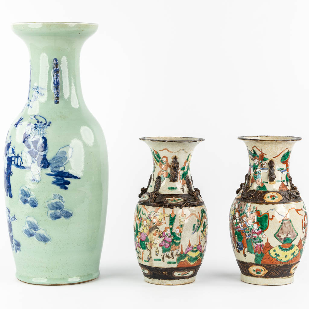 A Chinese vase blue-white decor of the Eight Immortals, added a pair of Nanking vases. (H:61 x D:23 cm)