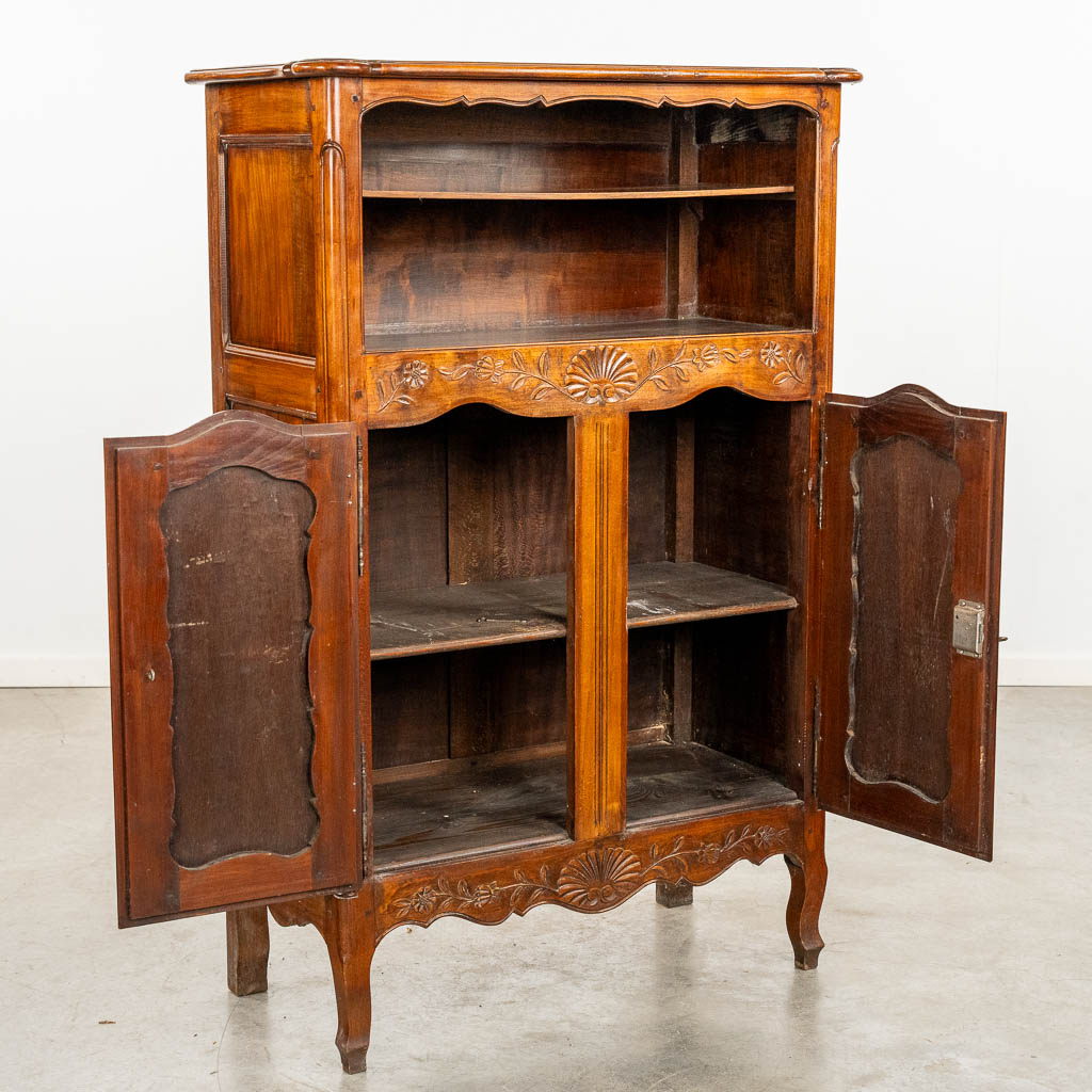 A two door-cabinet, sculptured wood finished with root-wood veneer. 