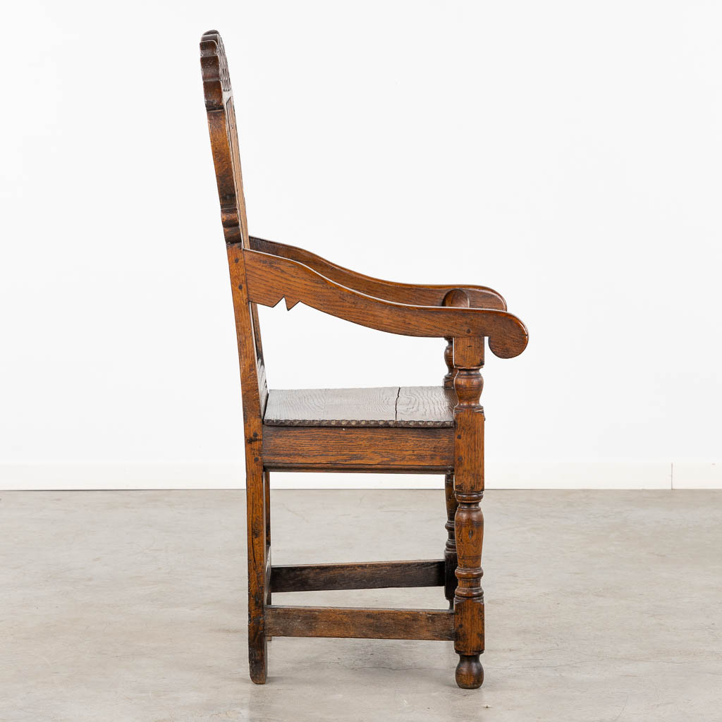 A wood-sculptured armchair, Flanders, 18th C. (L:55 x W:55 x H:117 cm)