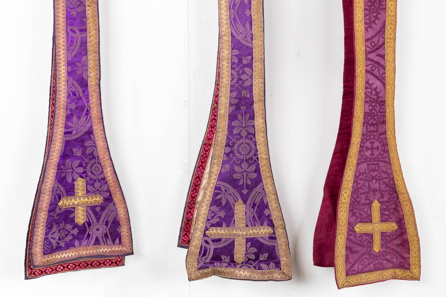 Two Dalmatics and a Roman Chasuble, added are a big collection of stola and maniple. 