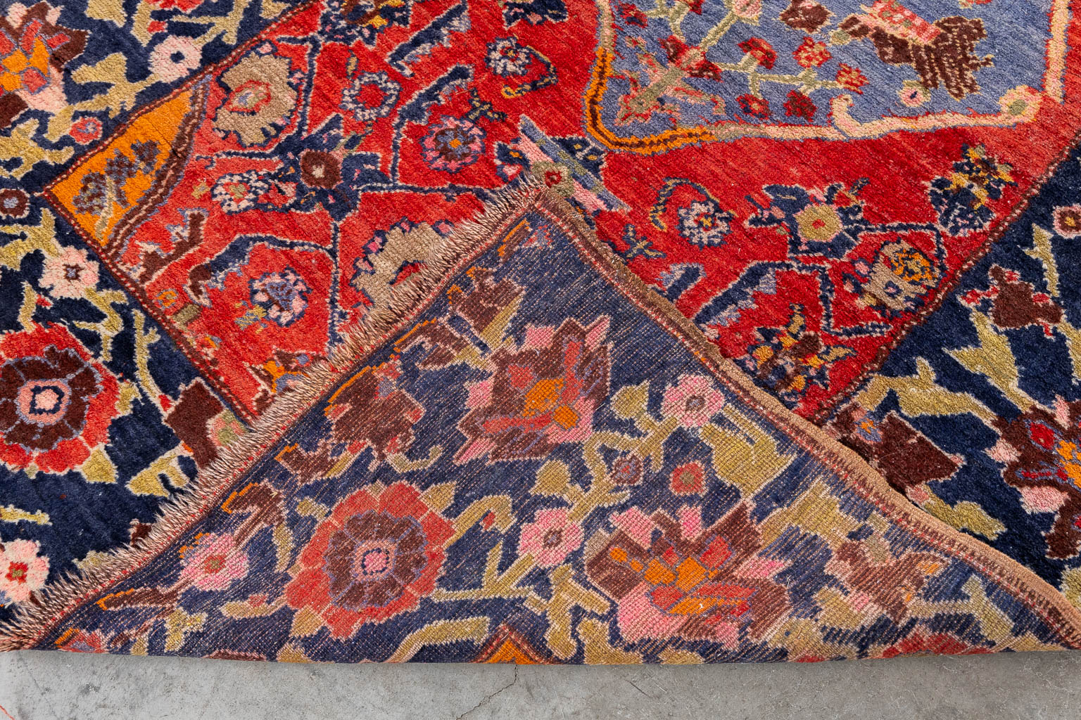 An Oriental hand-made carpet, dated 1939.. (W:124 x H:196 cm)