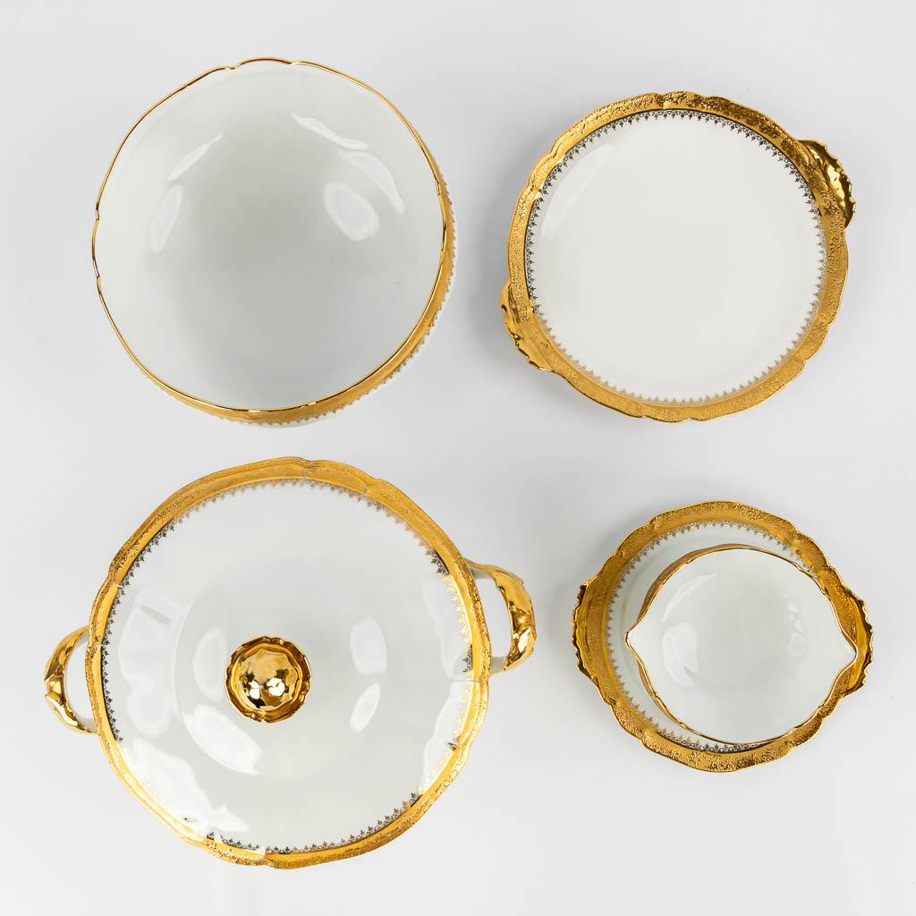 ULIM Limoges, a large dinner and coffee service, porcelain with a gilt rim. (L:26 x W:31 x H:20 cm)