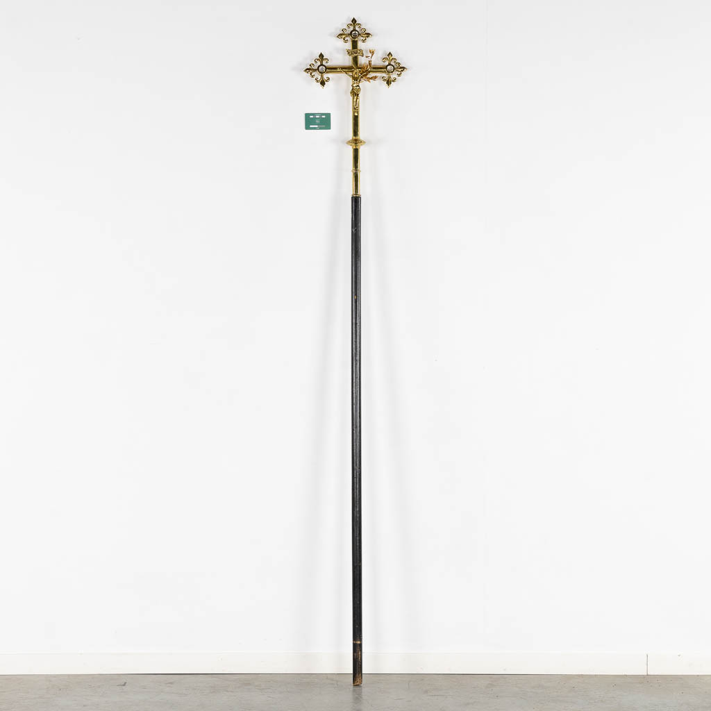 A bronze processional crucifix, richly decorated with cabochons. (W:33 x H:59 cm)