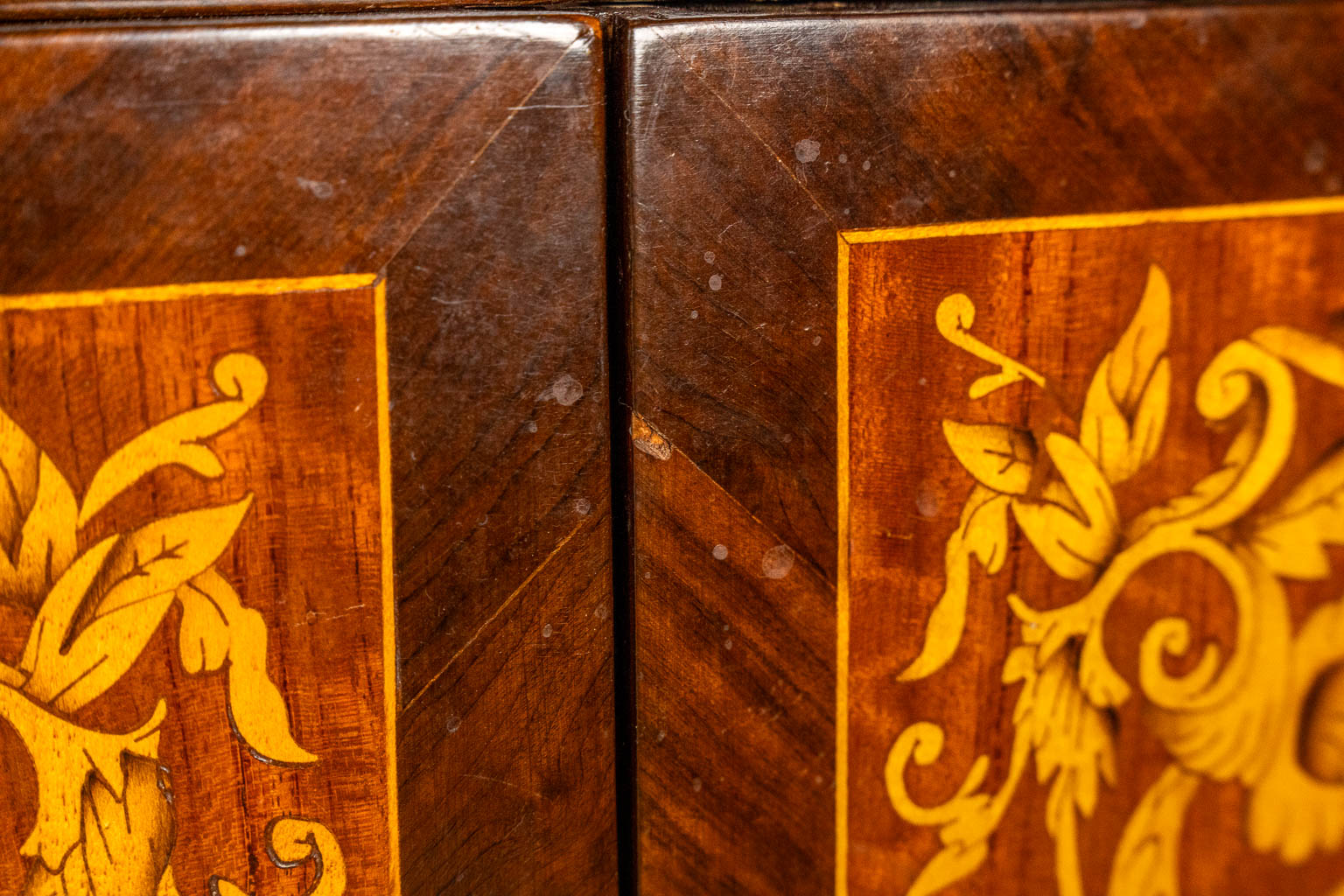 A two-door marquetry inlay cabinet, mounted with bronze and a marble. 20th C.