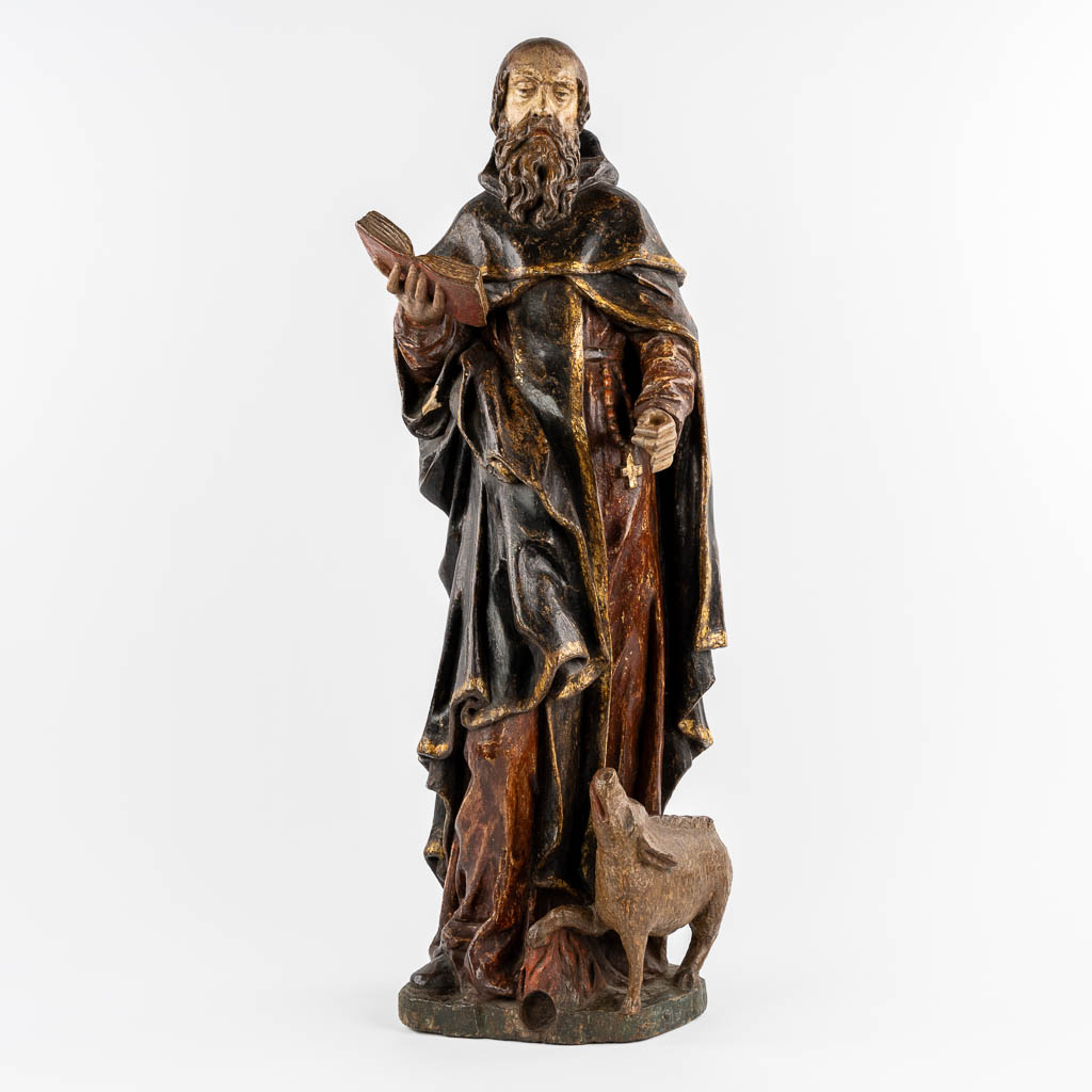 An antique wood-sculptured figurine of Saint Anthony the Great, with a pig. 18th C.