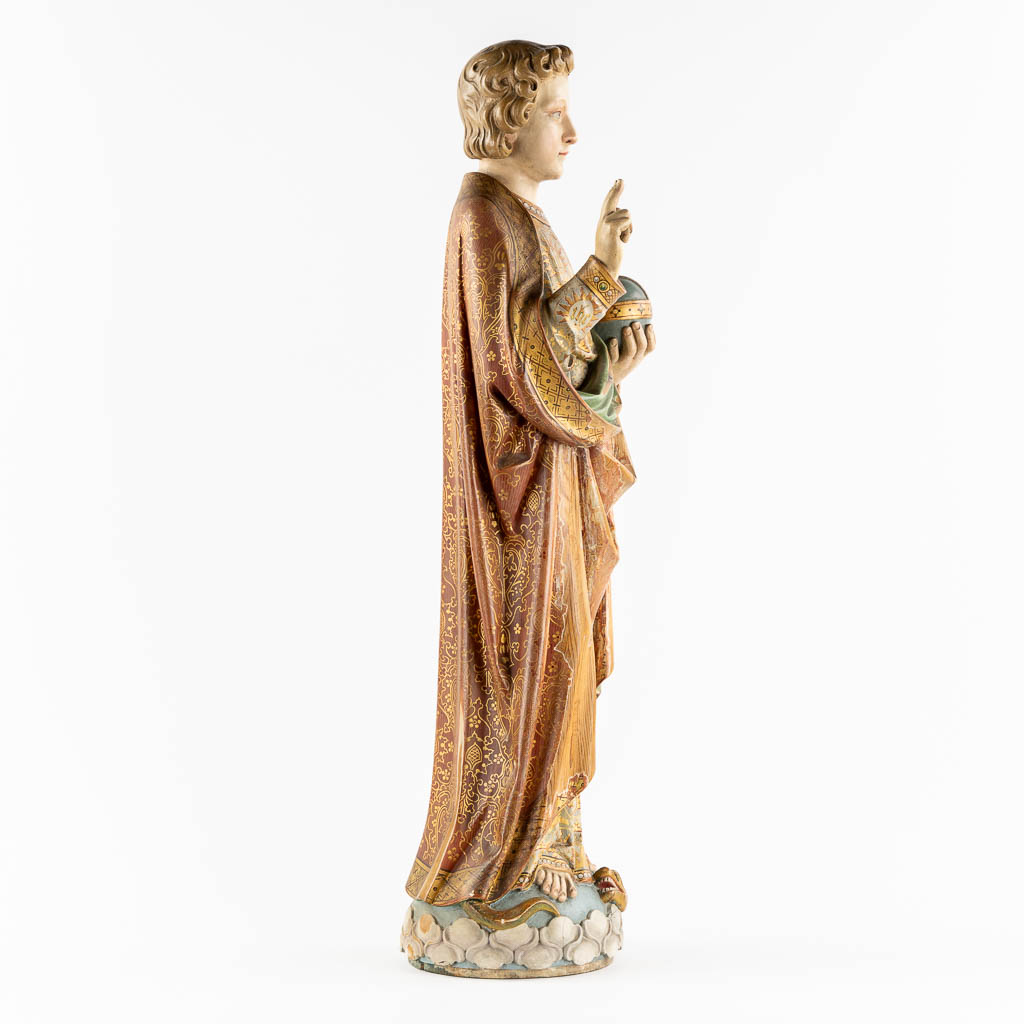 An antique wood-sculptured figurine of Salvator Mundi, holding a globus cruciger and serpent. 19th C. (L:22 x W:27 x H:87 cm)