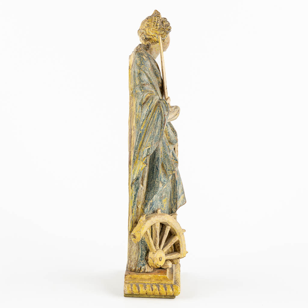 Saint Catherine, an antique wood sculpture, probably 18th C. (L:8 x W:13 x H:32 cm)