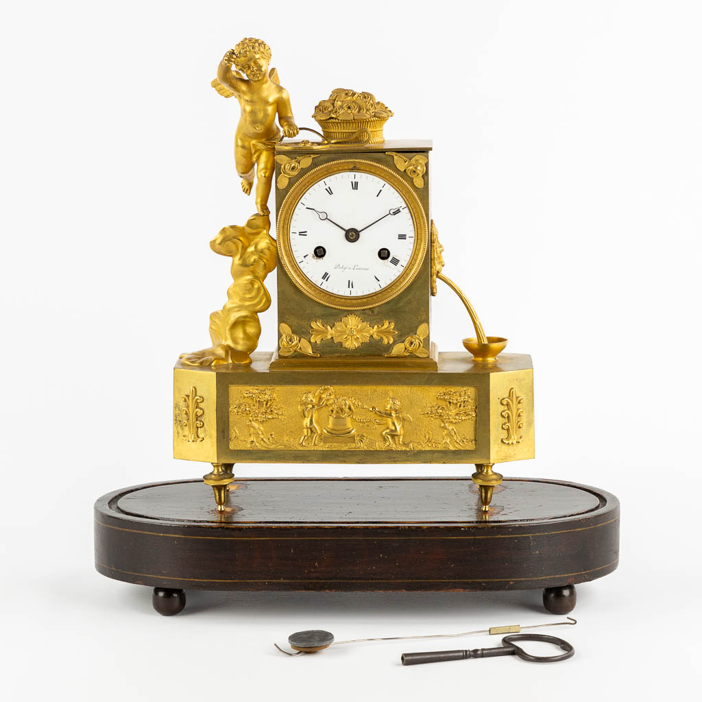 A mantle clock, Gilt bronze, Empire, 