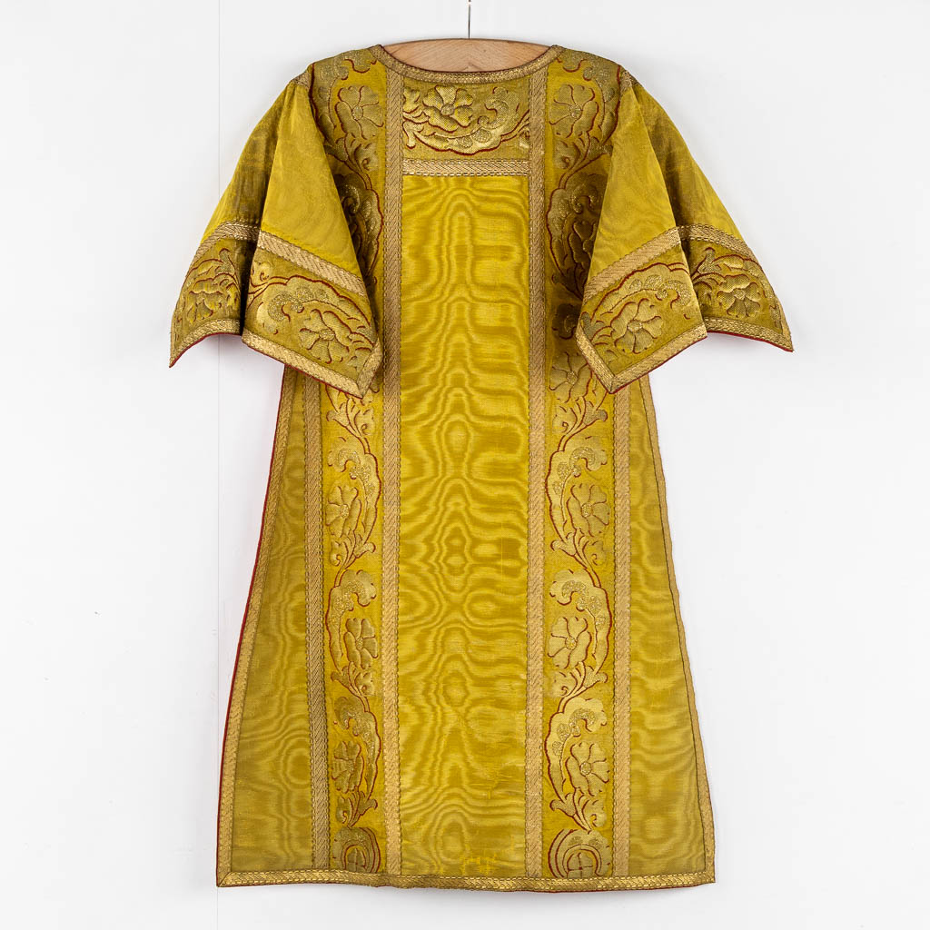 A Cope, a pair of Dalmatics and Two Roman Chasubles, Embroideries.