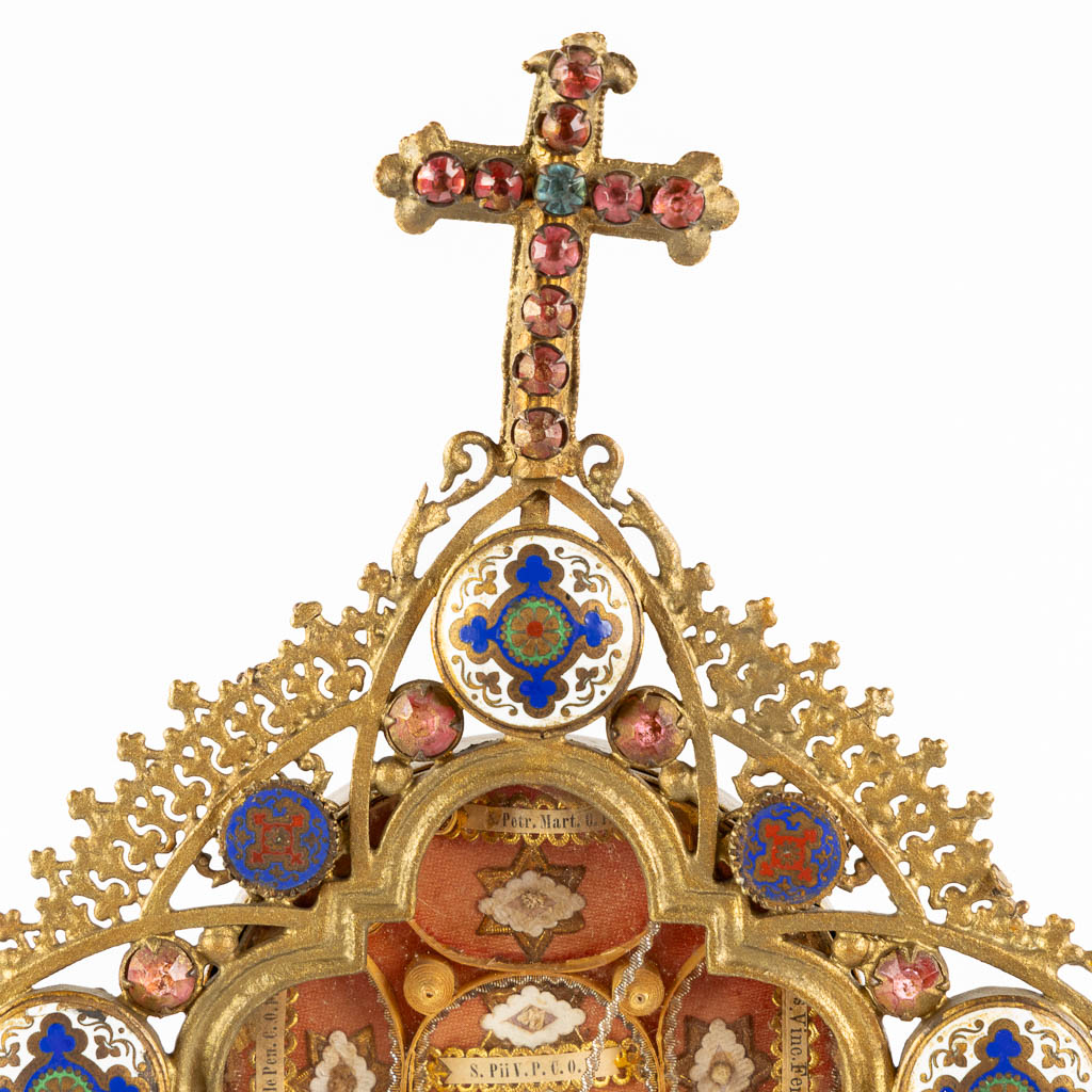 A reliquary monstrance with 6 relics, spelter and cloisonné enamel. 1901. (W:16 x H:36 cm)