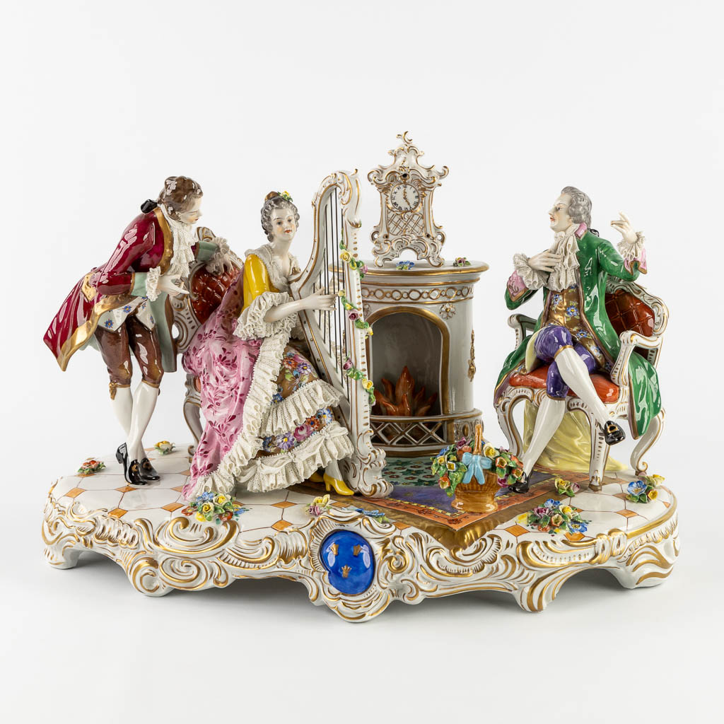 Volkstedt Rudolstadt, a large group 'Playing the harp' polychrome porcelain. 