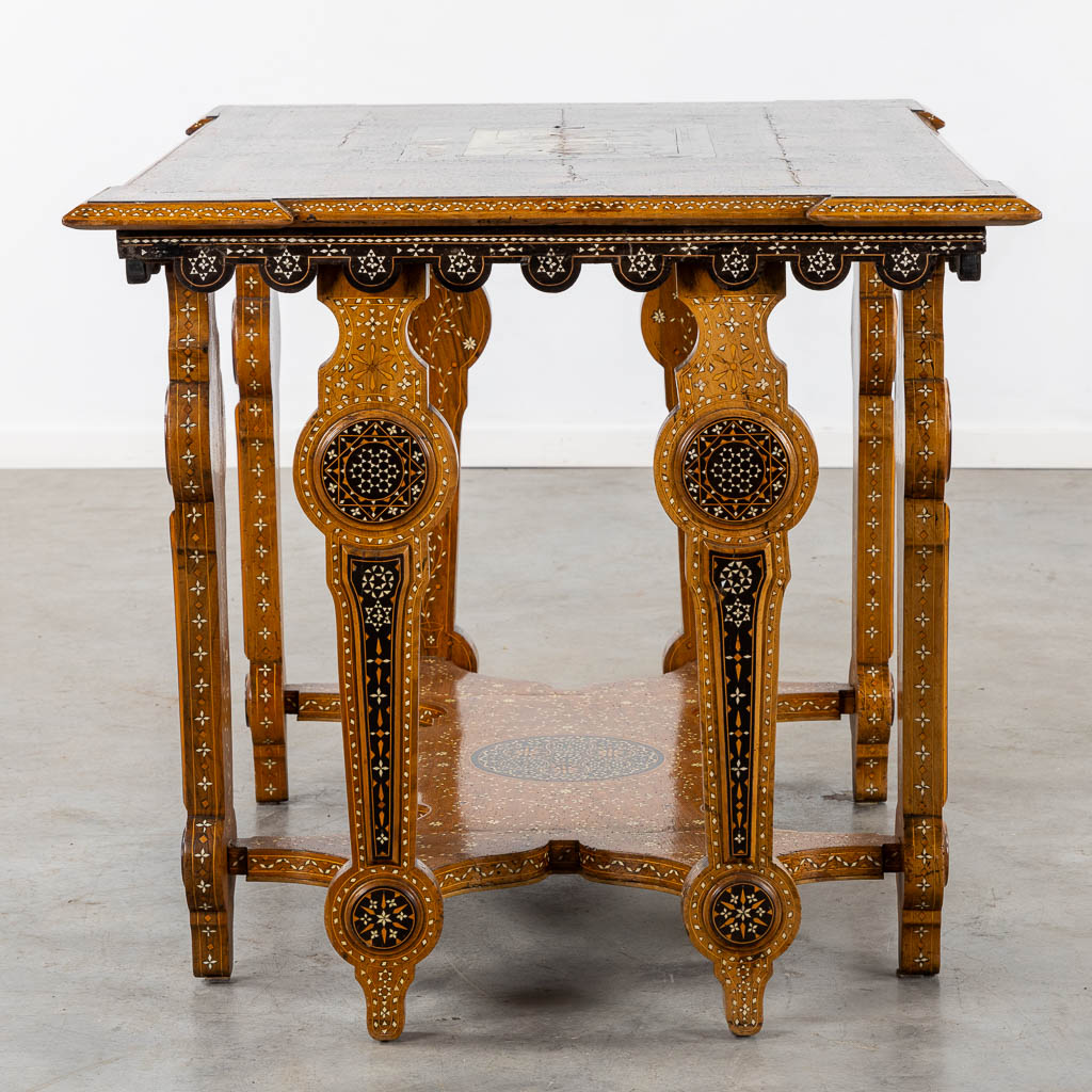 A Syrian table with two matching chairs, Marquetry and copper inlay, 19th C. (L:87 x W:121 x H:80 cm)