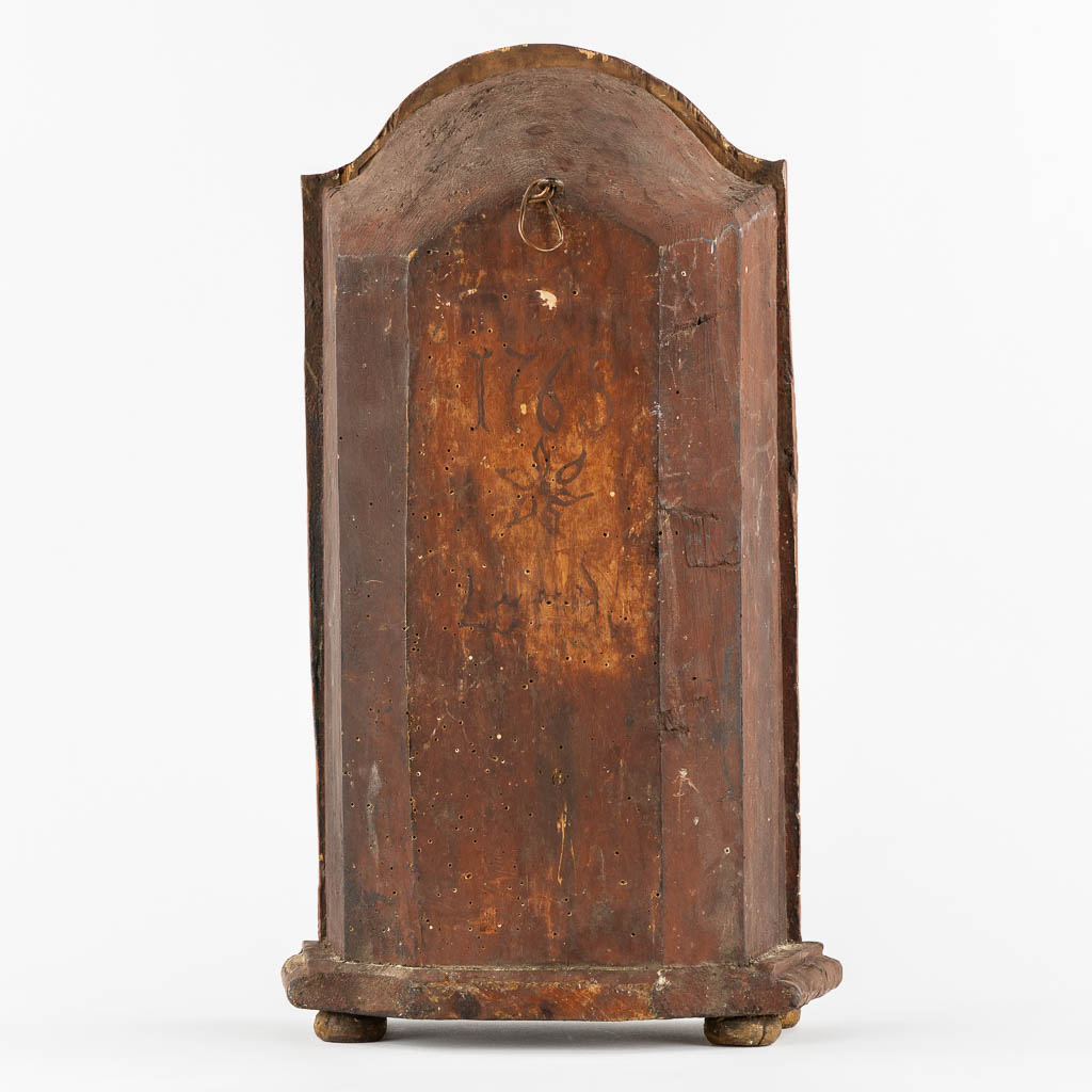 A reliquary cabinet with a relic of a foot, VM. Bach Cedron, dated 1768.