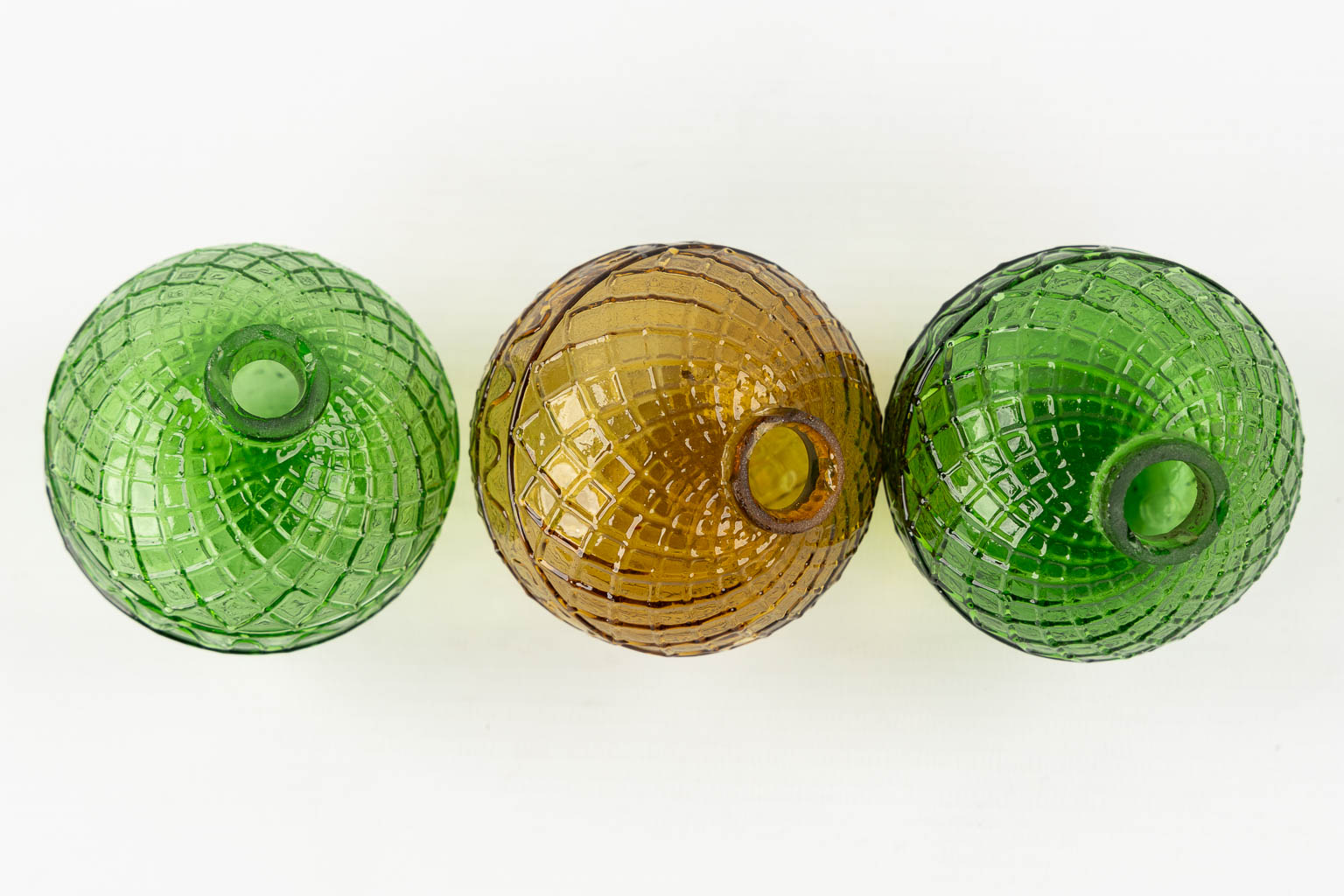 Gevelot Paris. Three antique target practice balls, Moulded glass, green and amber. 