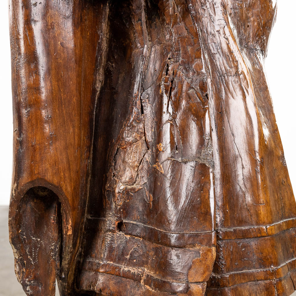 An antique wood sculpture, a figurine of a noble lady. 17th/18th C. (L:30 x W:53 x H:123 cm)