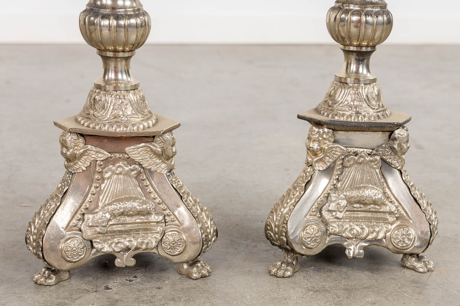 A pair of silver-plated church chandelsticks, added a pair of brass candelabra. (H:92 cm)