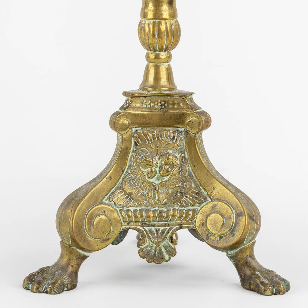 An antique candlestick, finished with putti, 18th C. (H:54 cm)