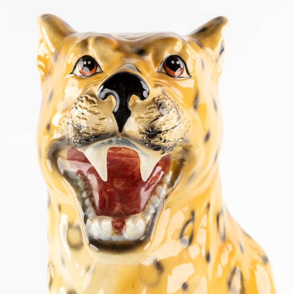 A large glazed faience Leopard, Italy, 20th C. (L:33 x W:46 x H:73 cm)