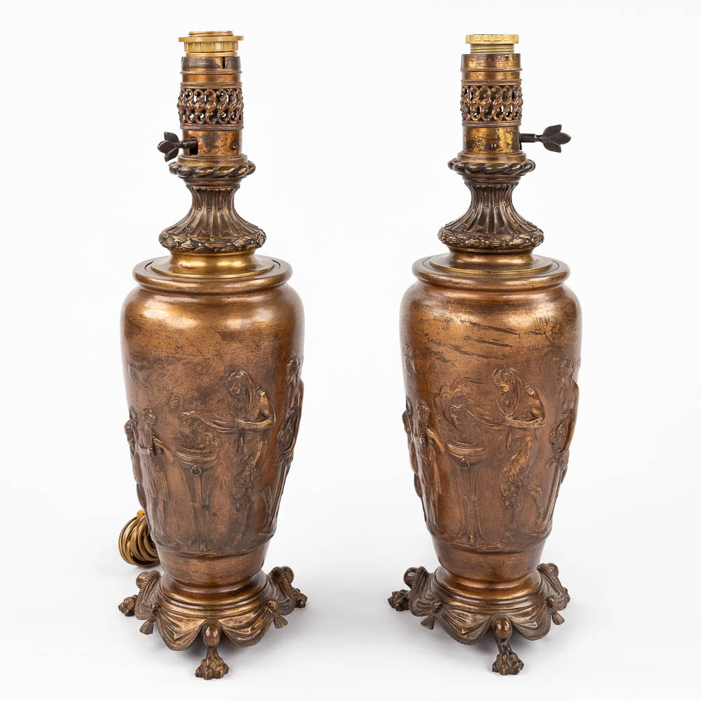 CLODION (1738-1814) 'Pair of oil lamps' bronze decorated with Satyrs and Nymphs. 19th C. (H:55 x D:17 cm)