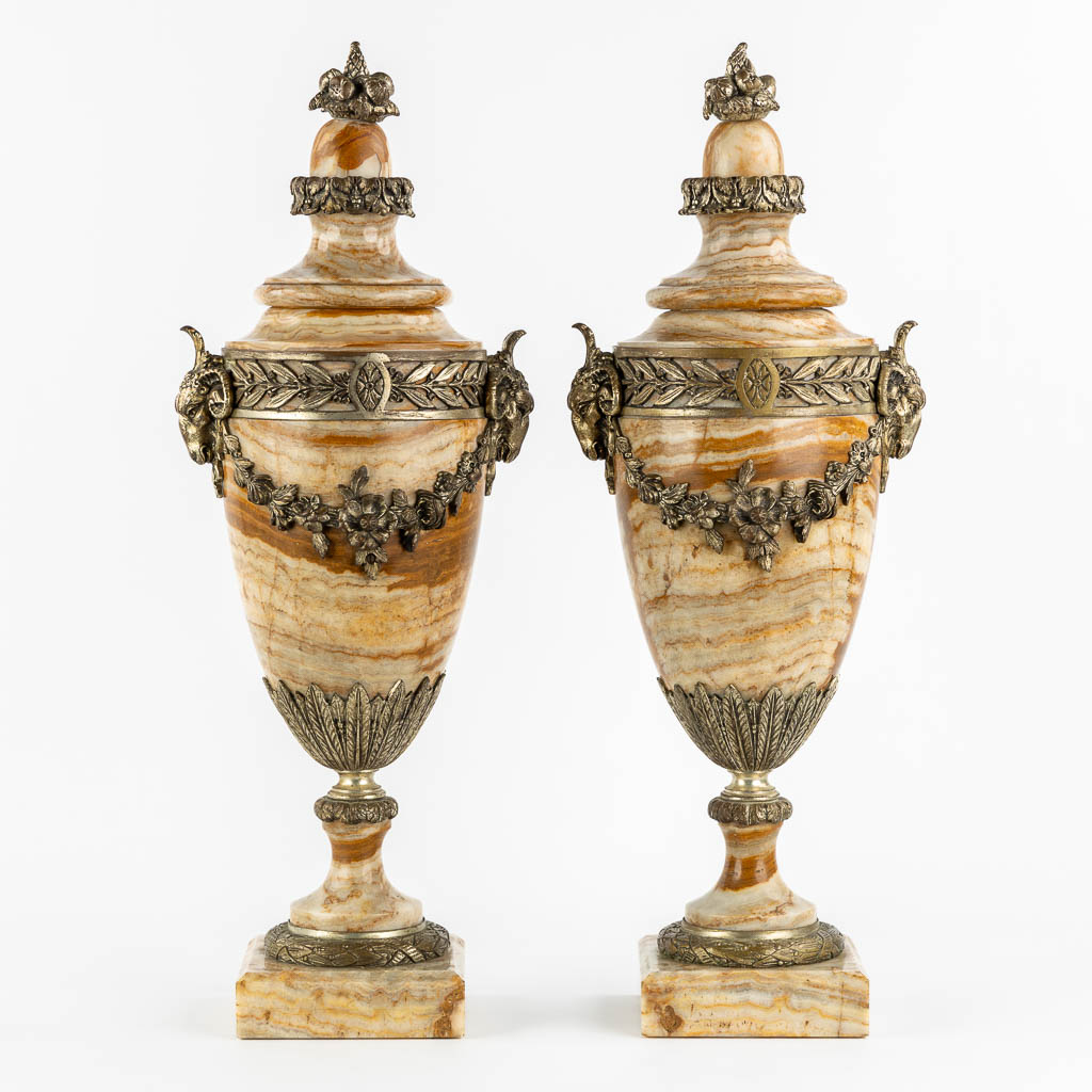 A pair of bronze mounted marble cassolettes with Ram