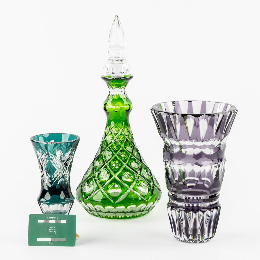 Val Saint Lambert, two vases, added a carafe. Cut and coloured crystal. (H:39,5 cm)