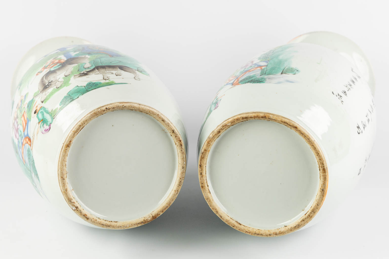 A pair of Chinese vases, decorated with playing children and kaligraphic texts. (H:59 x D:23 cm)