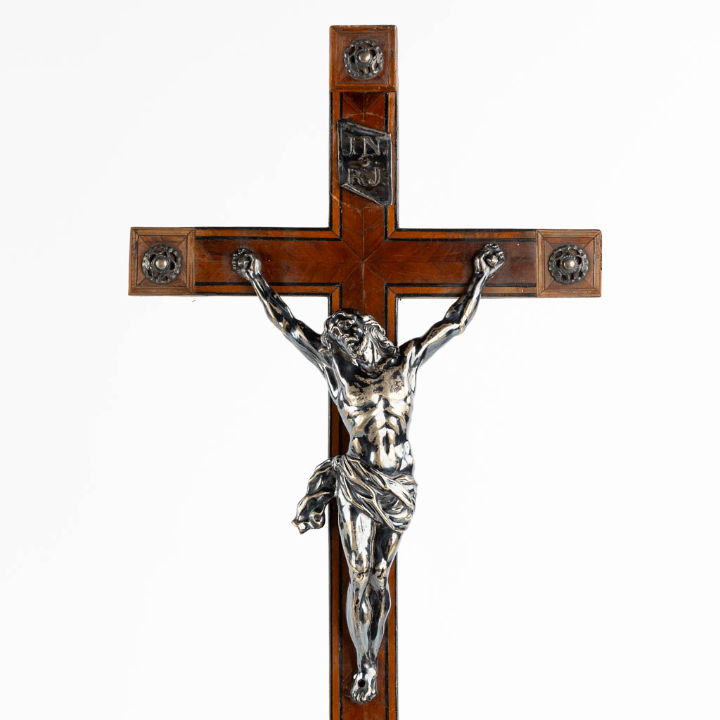 Two crucifixes with a silver Corpus Christi, 19th C. (W:24 x H:70 cm)