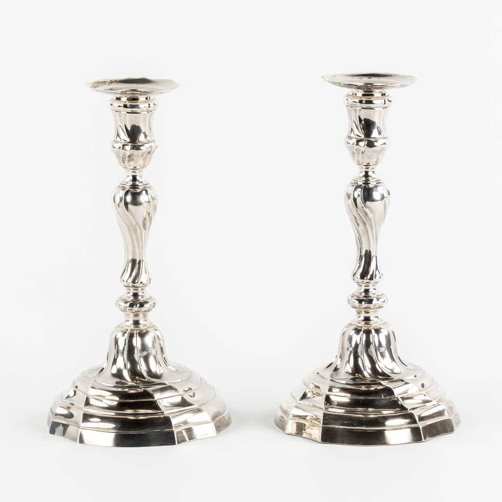 A pair of Louis XV style candlesticks, Silver, 1815-1832, after 18th C. models. 652g. 