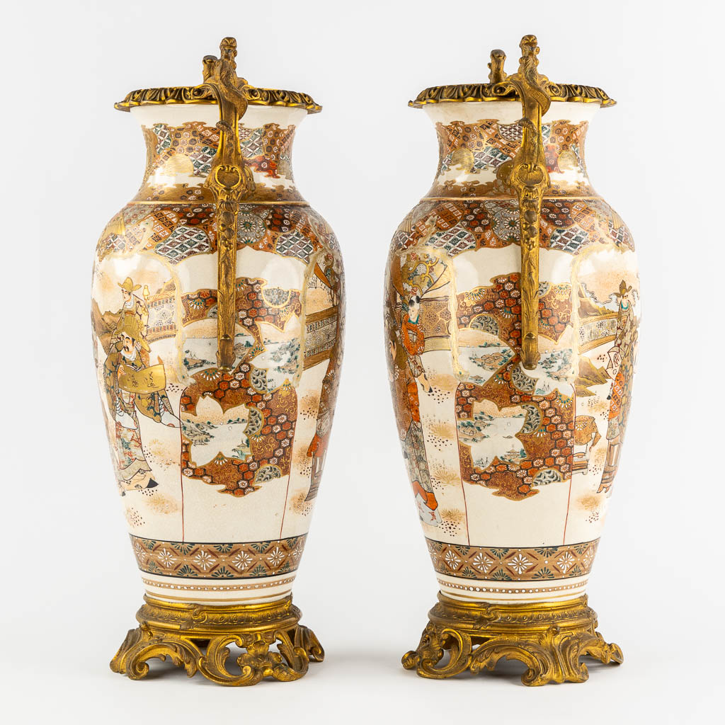 A pair of Japanese Kutani vases, mounted with bronze. Added a Chinese Canton vase. (L:24 x W:27 x H:56 cm)