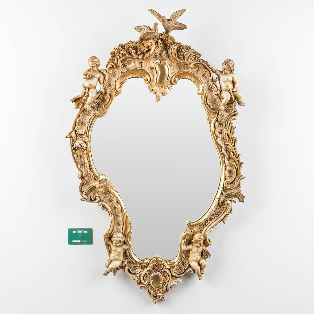 An antique mirror with musical putti. 1886. (W: 60 x H: 97 cm)