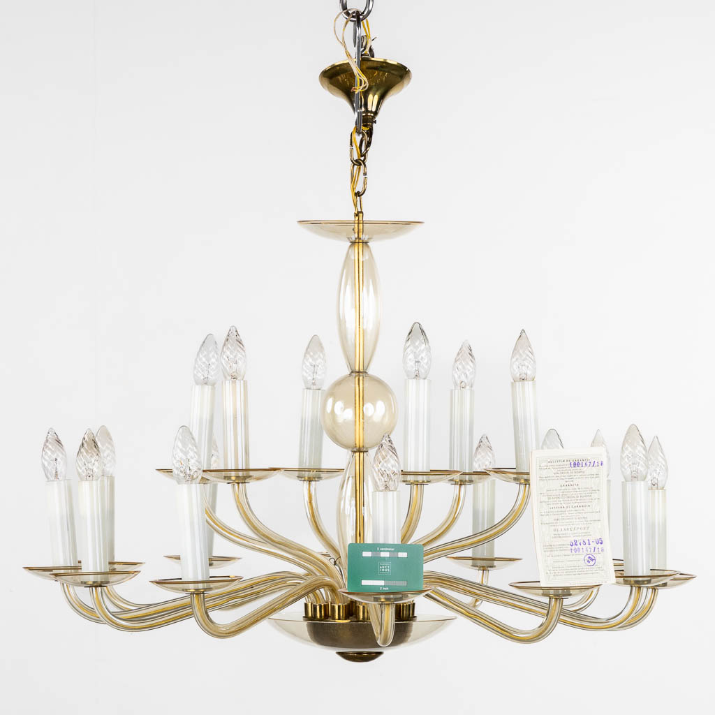 A Bohemian tinted glass chandelier, 18 points of light. (H:65 x D:89 cm)