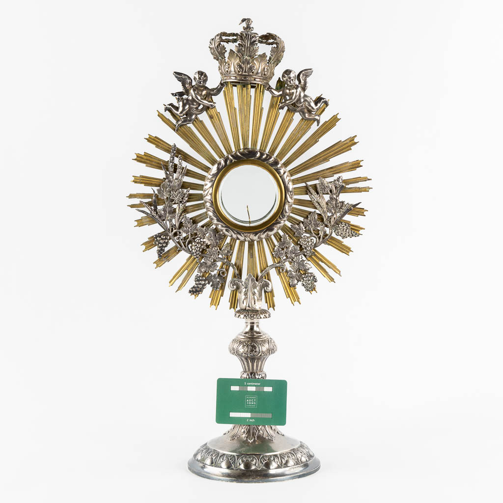 A sunburst monstrance, silver and brass, Henricus De Curte, Ghent, circa 1868. (W:30 x H:55 cm)