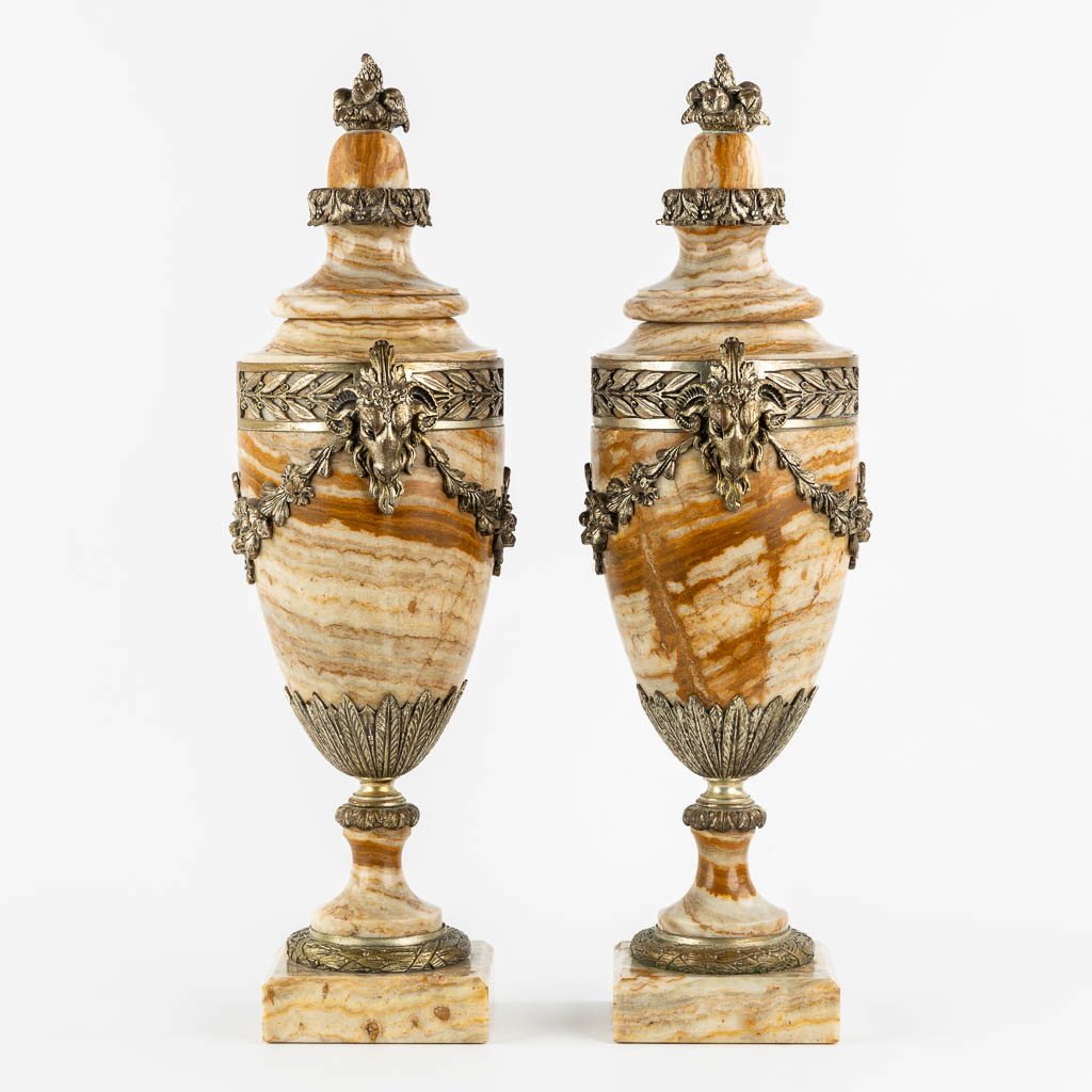 A pair of bronze mounted marble cassolettes with Ram