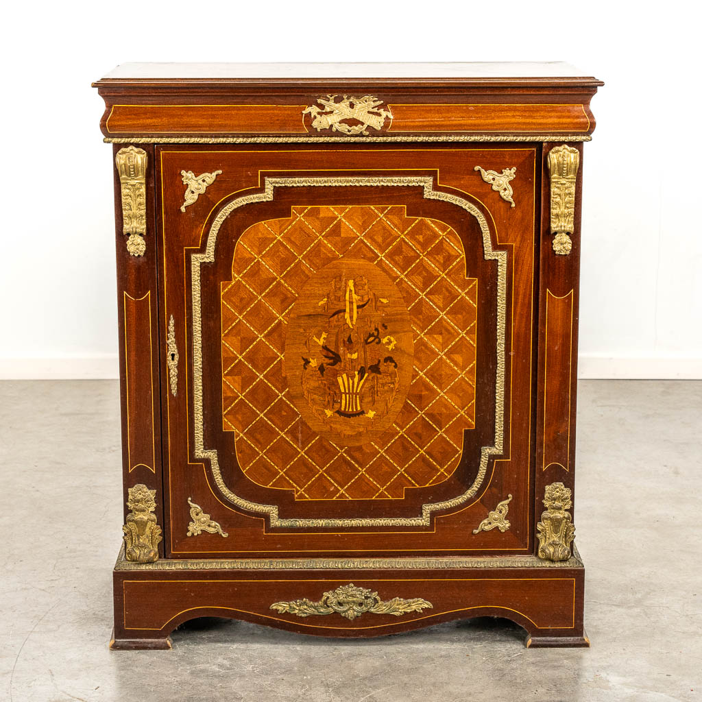 A single door cabinet, marquetry inlay mounted with bronze. 20th C. 