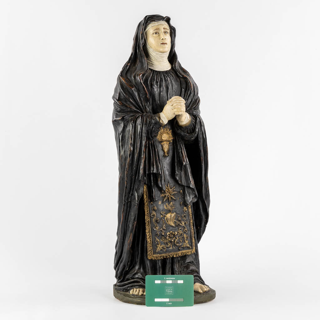 Saint Genoveva of Paris, polychrome terracotta with glass eyes. (W:17 x H:54 cm)