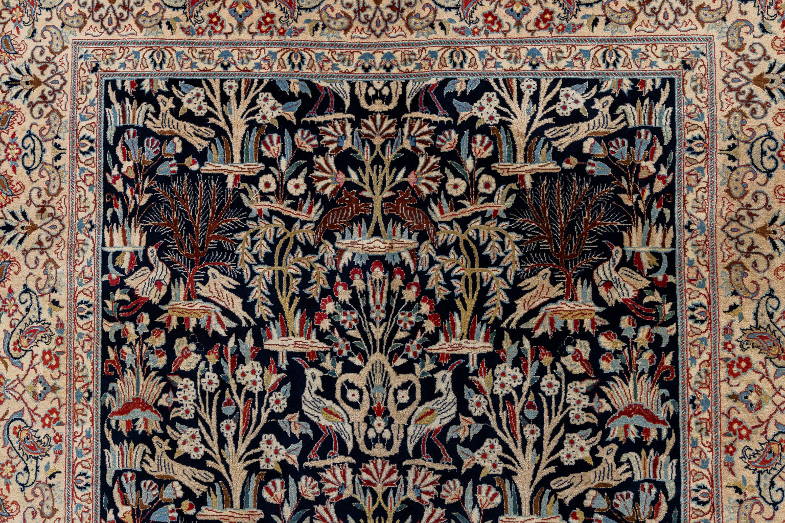 An Oriental hand-made carpet, birds and trees, Isphahan/Isfahan. (L:181 x W:107 cm)