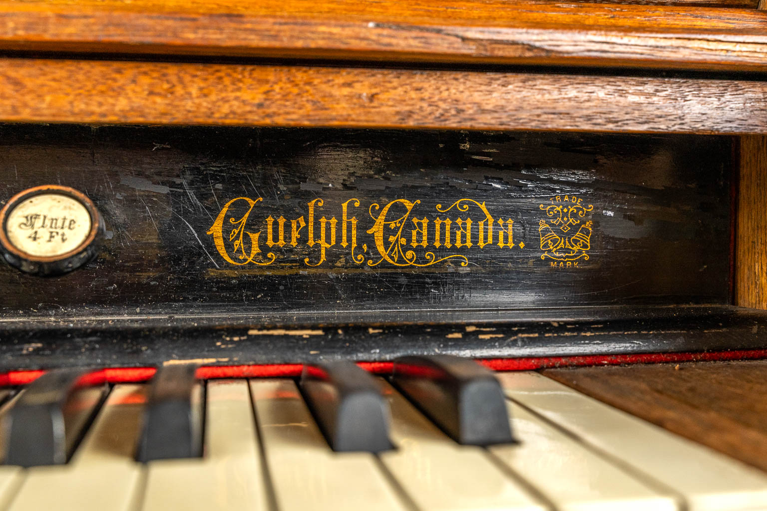 An antique organ, sculptured wood in Gothic Revival style. Circa 1900.