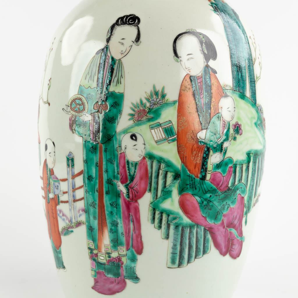 A Chinese vase decorated with ladies and children, 19th/20th C. (H:44 x D:21 cm)