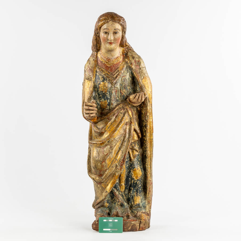 An antique wood sculptured figurine of a saint, polychrome, 14th C. (W:27 x H:78 cm)