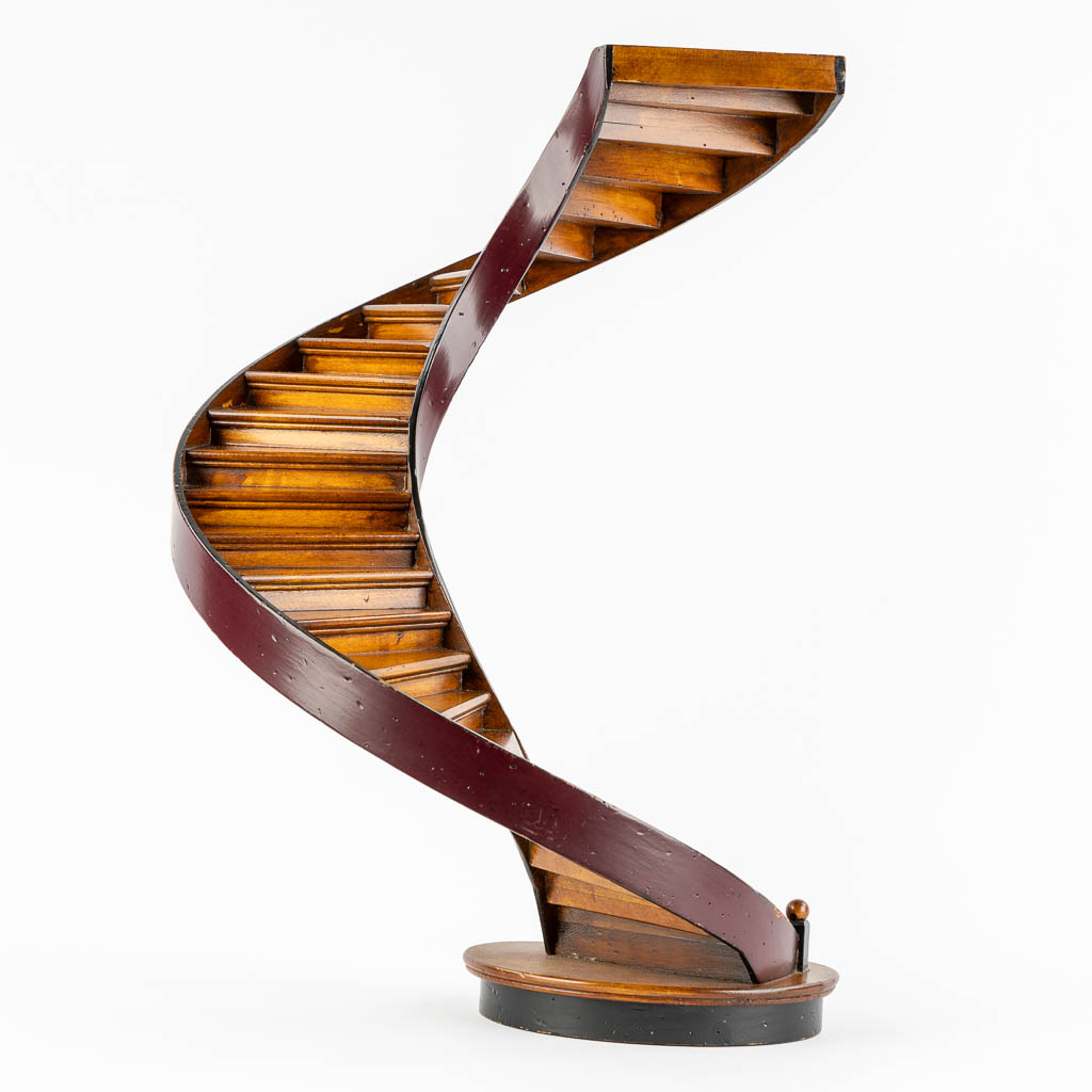 An architectural model of a revolving staircase, wood. 20th C. (H:47,5 x D:29 cm)