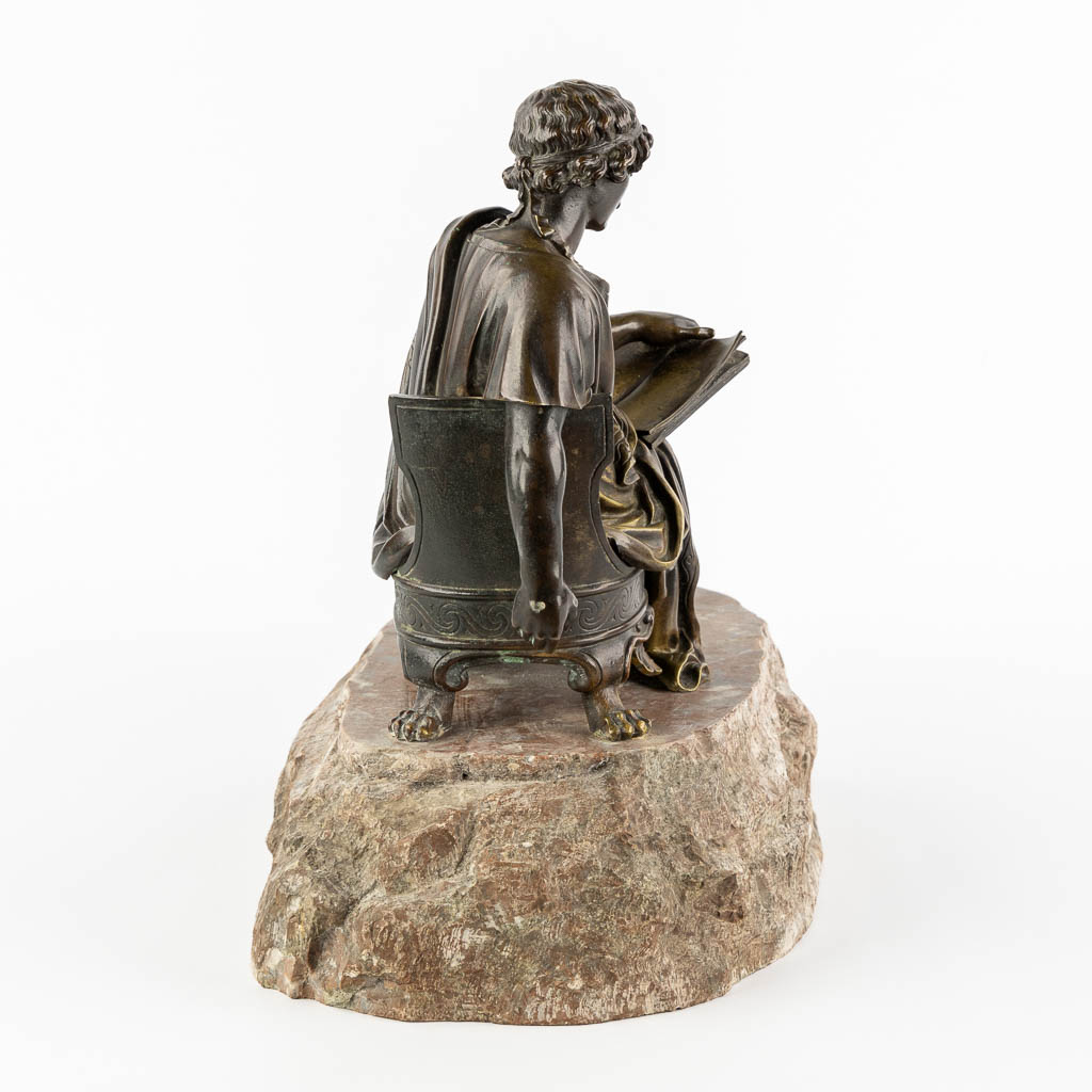 The Reading Roman, patinated bronze. 19th C. (L:23 x W:38 x H:34 cm)