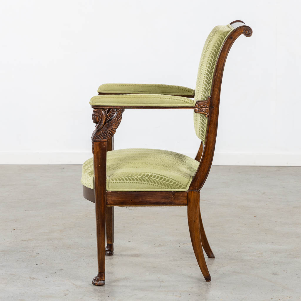 An antique armchair, sculptured wood in Empire style. (L:60 x W:59 x H:91 cm)