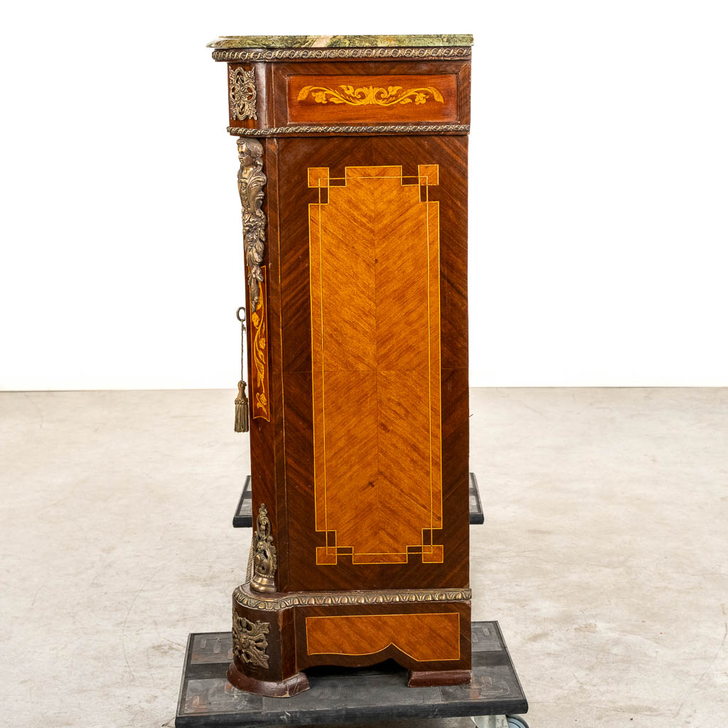 A two-door marquetry inlay cabinet, mounted with bronze and a marble. 20th C.