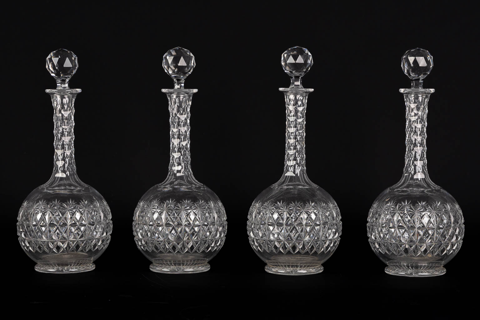 A matching set of 8 caraffes, added are a pair. Cut crystal. (H:34 cm)