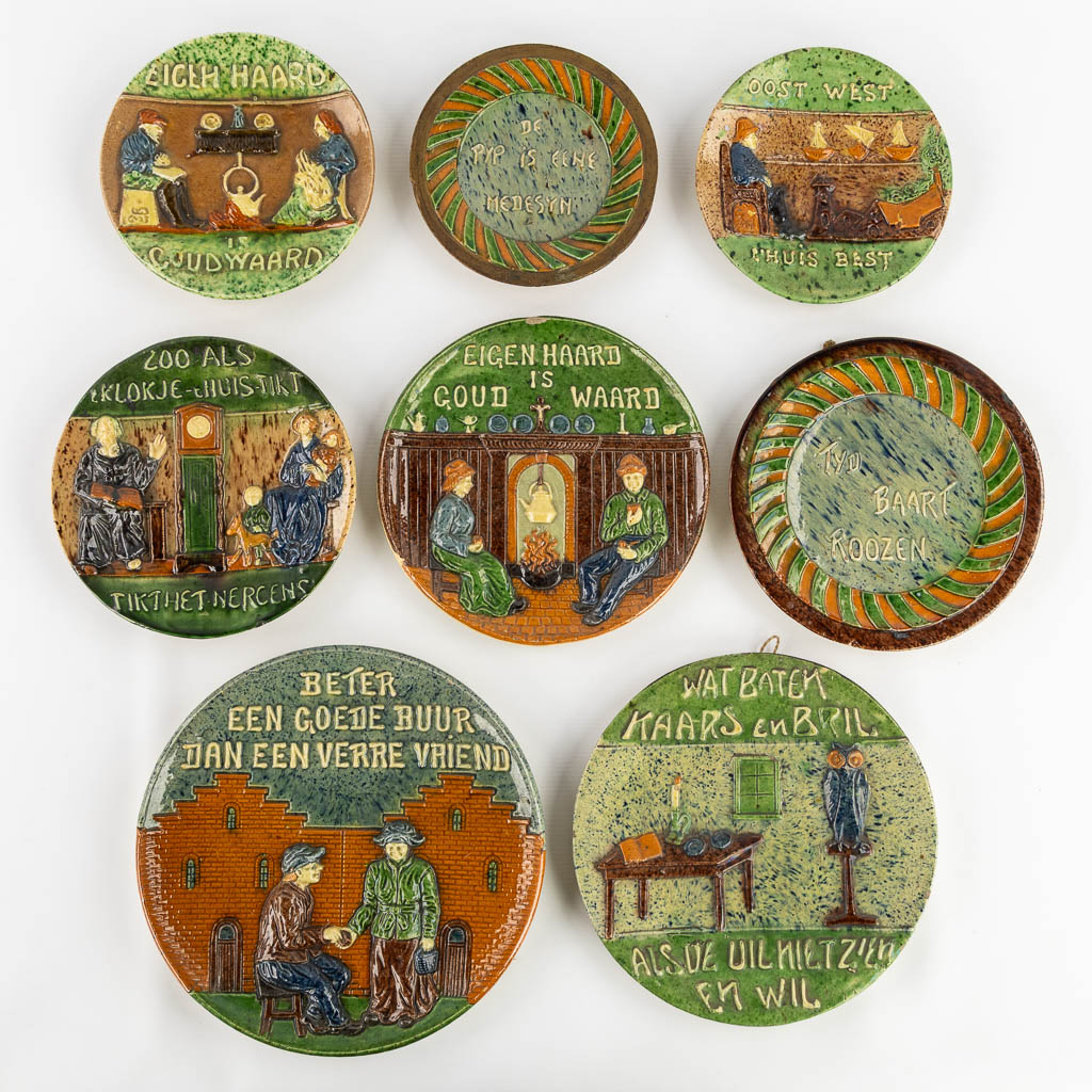 Eight plates with 'Proverbs and Sayings' made of Flemish Earthenware. 