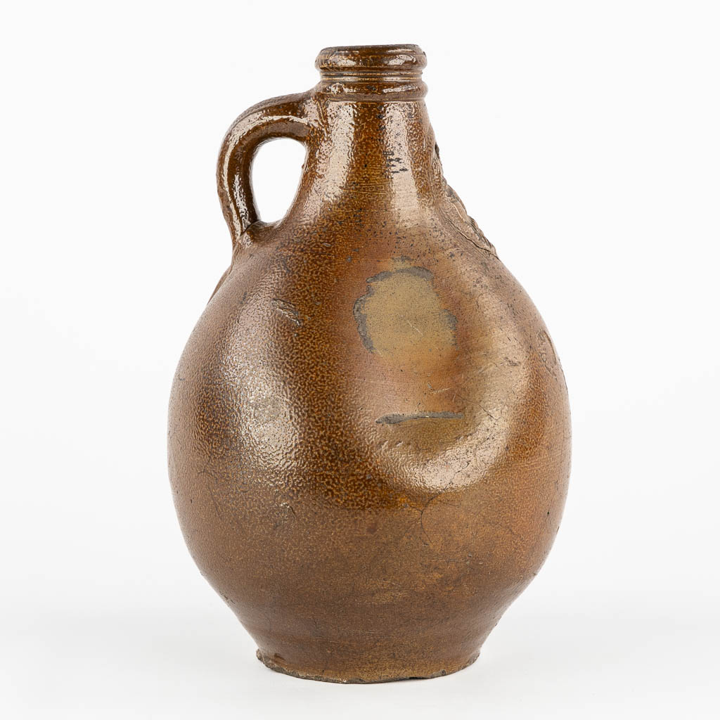 An antique Bartmann jug with three stamps, 17th C. (H:27 x D:17 cm)