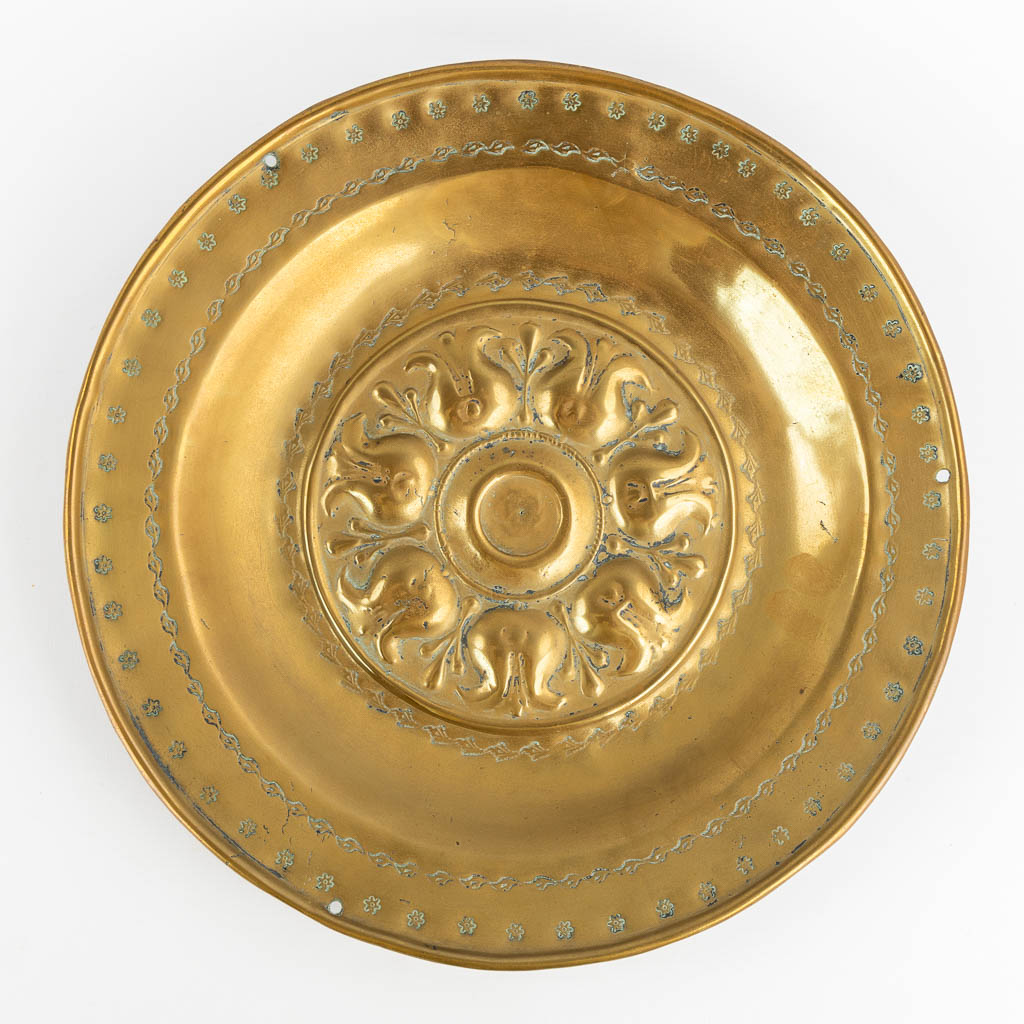 A brass Alms Dish depicting 