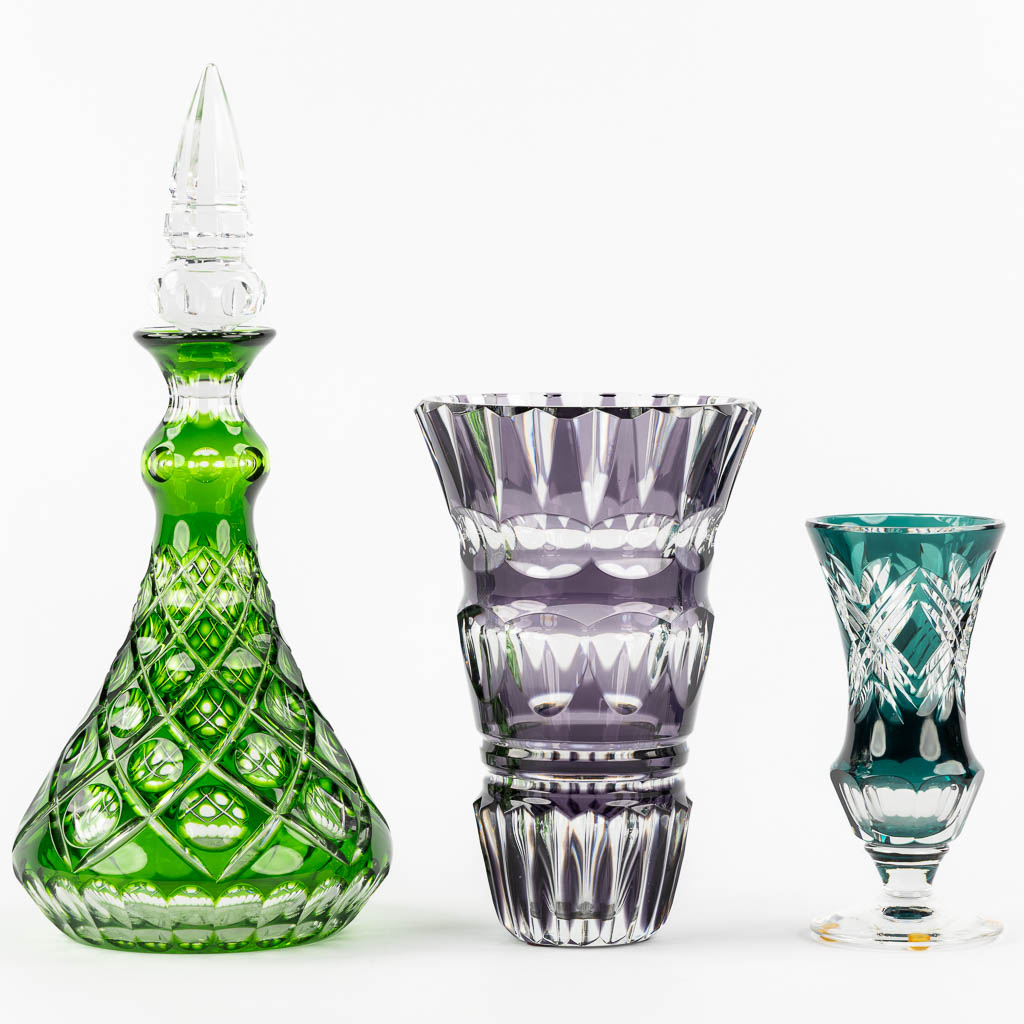 Val Saint Lambert, two vases, added a carafe. Cut and coloured crystal. (H:39,5 cm)