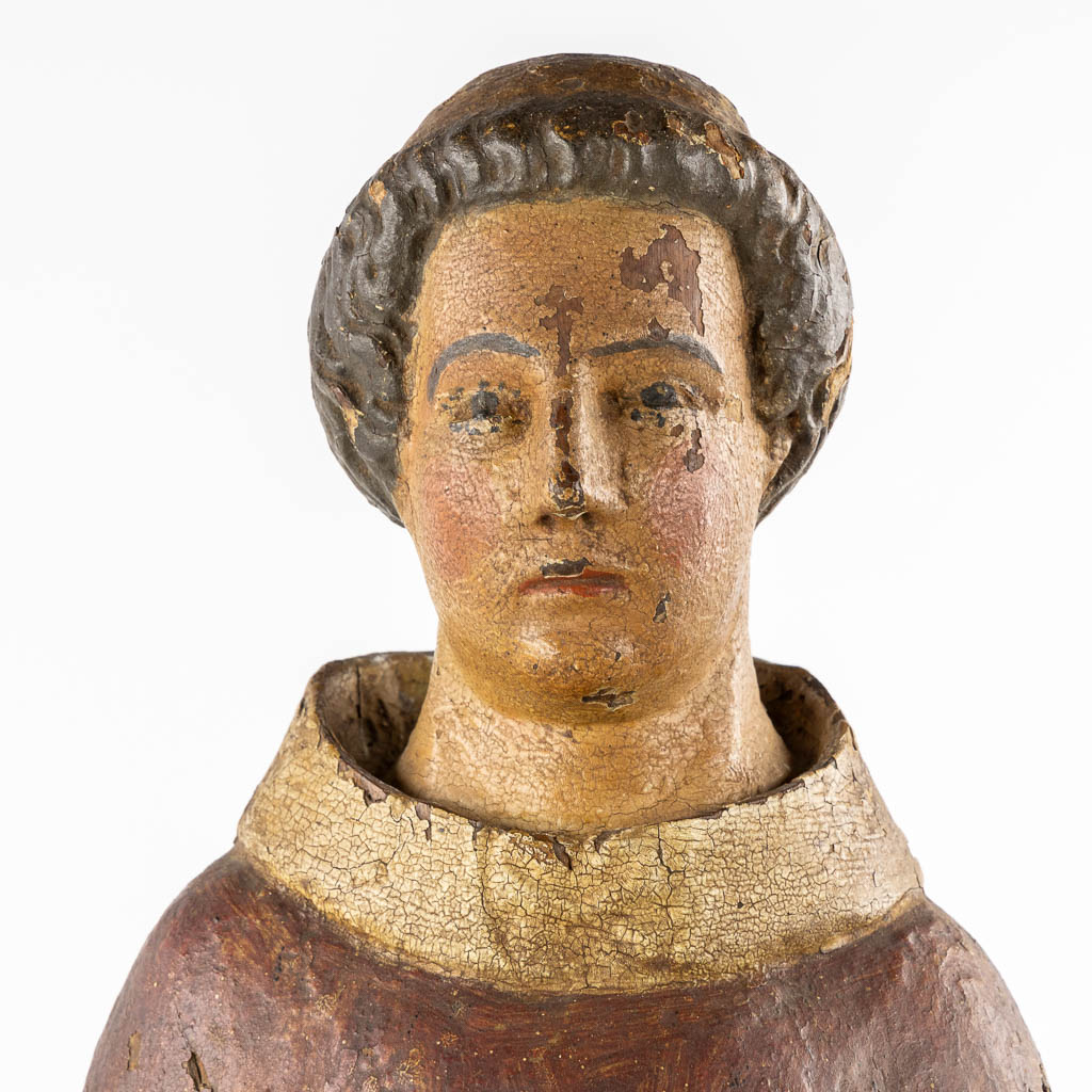 Saint Laurentius, Deacon. A wood-sculpture, oak, 14th C.  (L:20 x W:25,5 x H:90 cm)