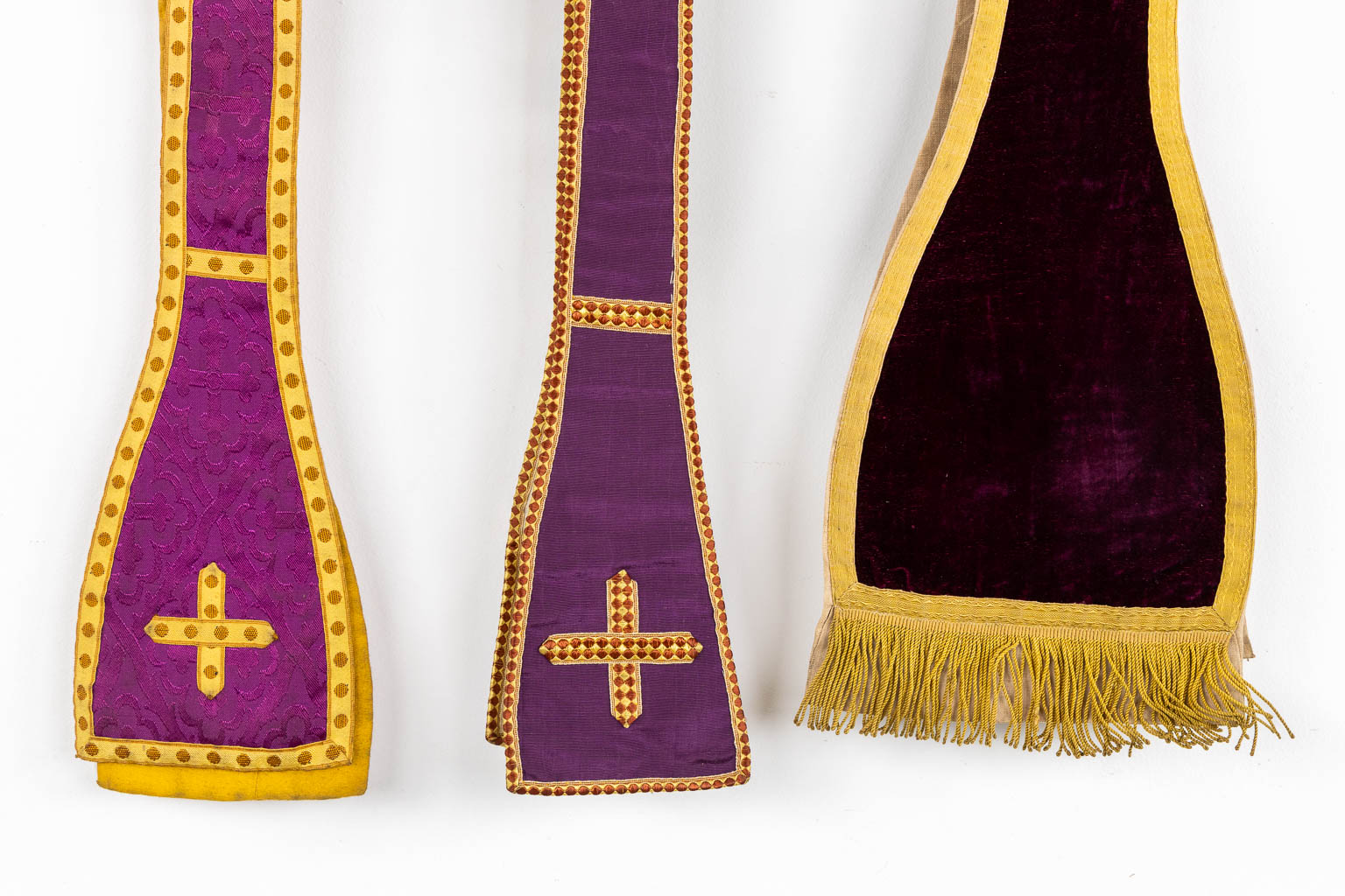 Two Dalmatics and a Roman Chasuble, added are a big collection of stola and maniple. 